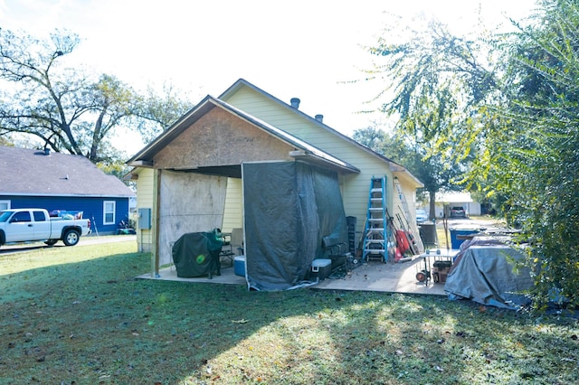 view of property exterior featuring a lawn