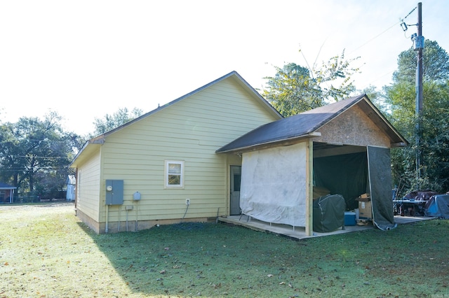 back of house with a yard