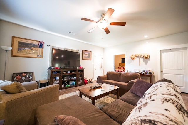 living room with hardwood / wood-style floors and ceiling fan