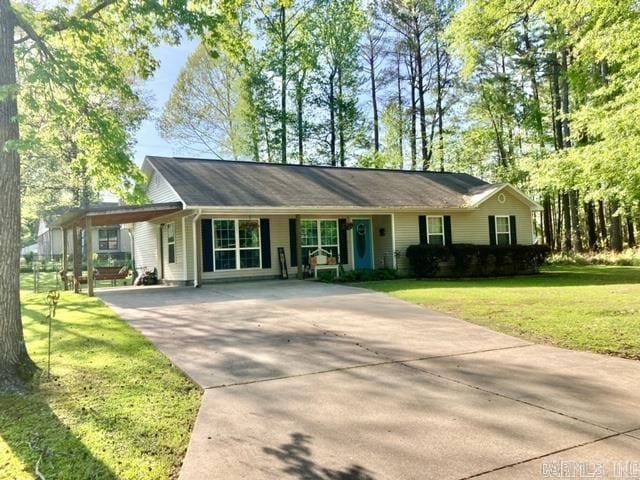 single story home featuring a carport and a front lawn