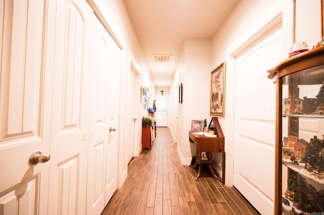 hall with dark hardwood / wood-style floors