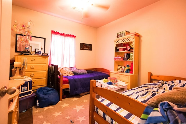 bedroom featuring hardwood / wood-style flooring and ceiling fan