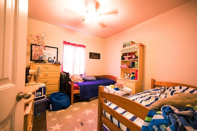 bedroom featuring hardwood / wood-style floors and ceiling fan