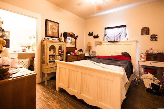 bedroom featuring dark wood-type flooring and ceiling fan