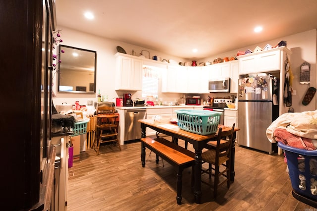 kitchen featuring white cabinetry, appliances with stainless steel finishes, and light hardwood / wood-style floors