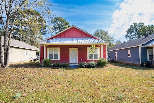 bungalow with central AC and a front lawn