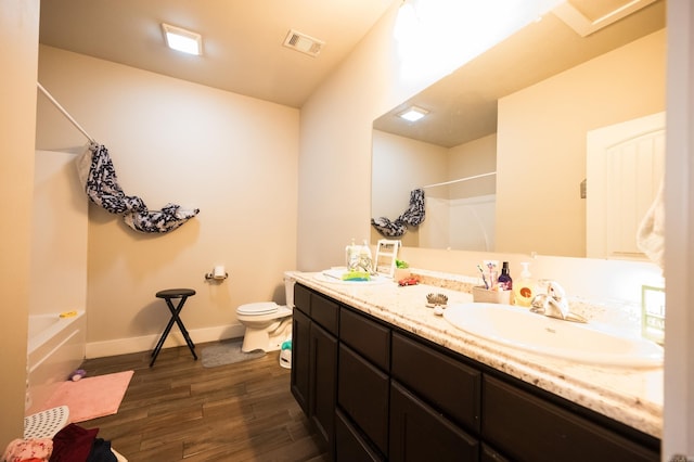 bathroom featuring hardwood / wood-style floors, vanity, and toilet