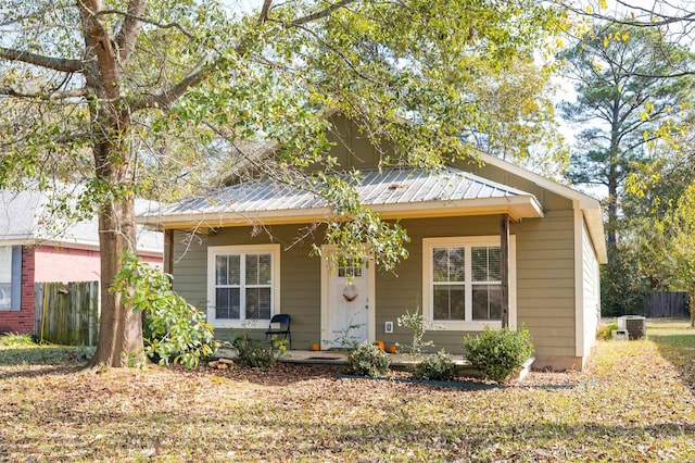 bungalow-style house featuring a porch and cooling unit