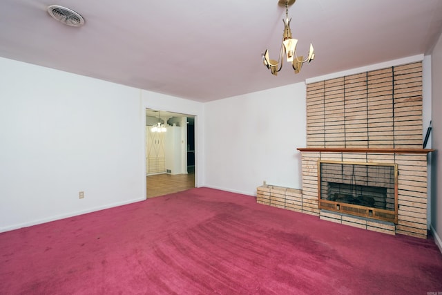 unfurnished living room featuring a brick fireplace and carpet