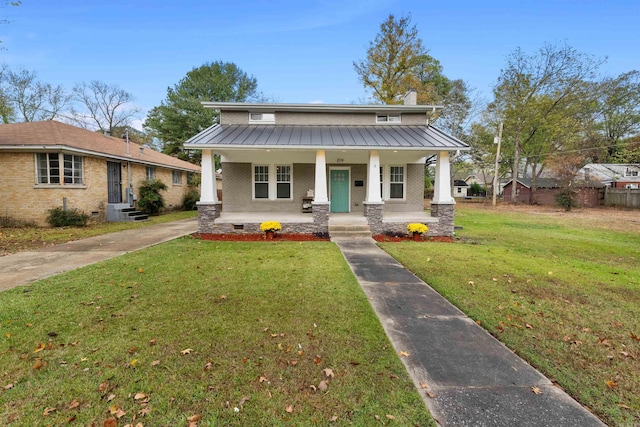 bungalow-style home with covered porch and a front lawn