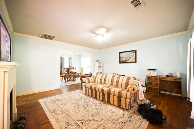 living room with dark wood-type flooring and crown molding