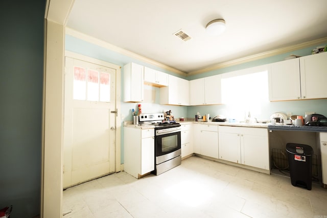 kitchen with white cabinets and stainless steel range with electric cooktop