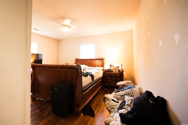 bedroom featuring dark hardwood / wood-style flooring and ceiling fan