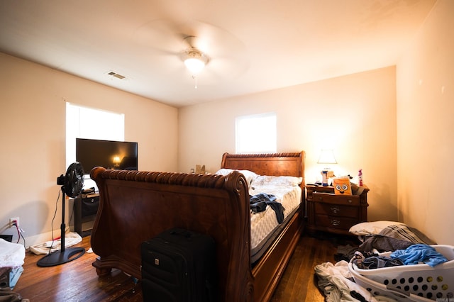 bedroom featuring dark wood-type flooring and ceiling fan