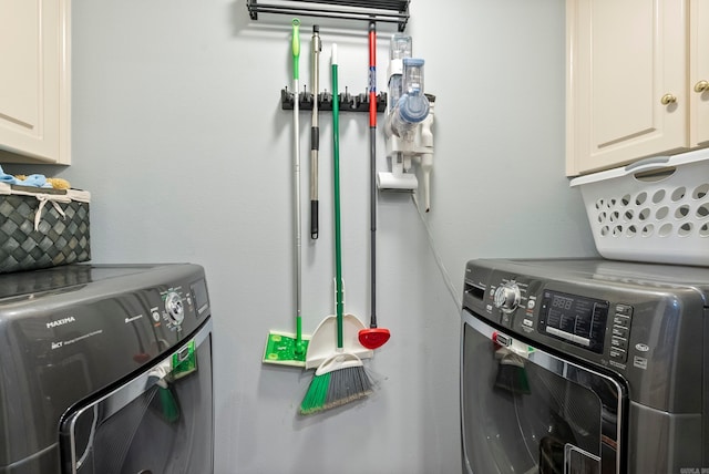 washroom with cabinets and separate washer and dryer