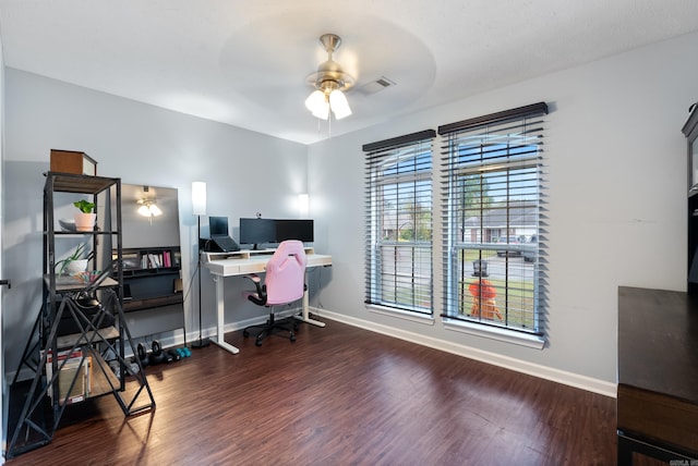 home office featuring dark hardwood / wood-style floors and ceiling fan