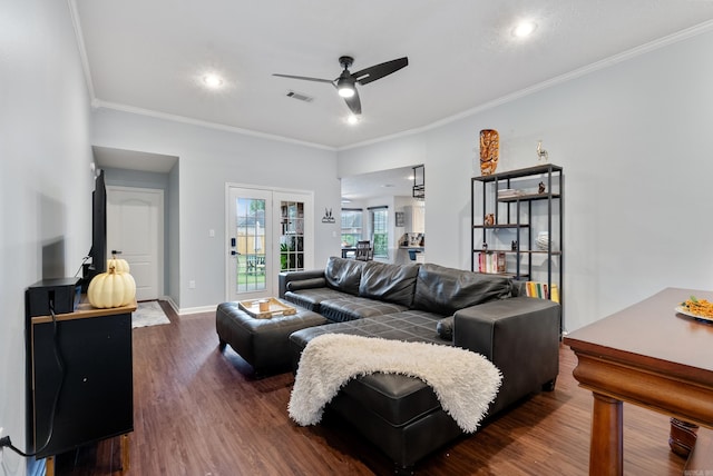 living room featuring ornamental molding, dark hardwood / wood-style flooring, and ceiling fan