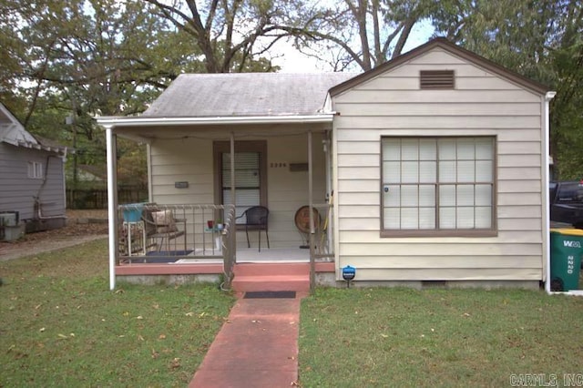 bungalow featuring a porch and a front yard