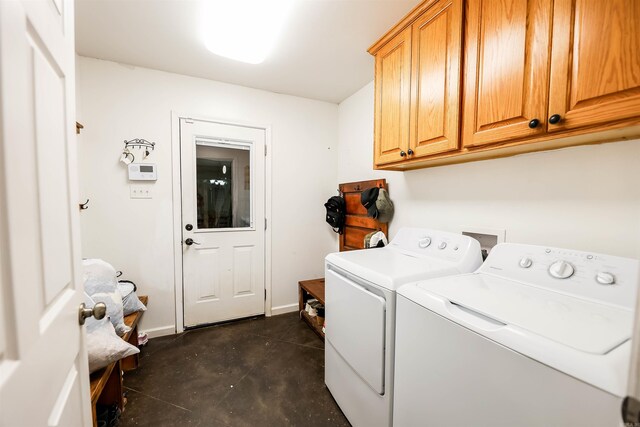 169 Whispering Oak Cir, El Dorado, AR 71730 - laundry room with cabinet space, washer and clothes dryer, and baseboards