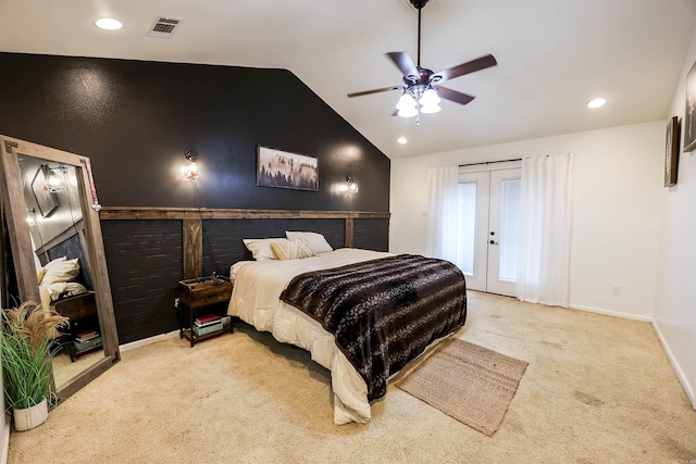 bedroom featuring lofted ceiling, french doors, light colored carpet, and ceiling fan