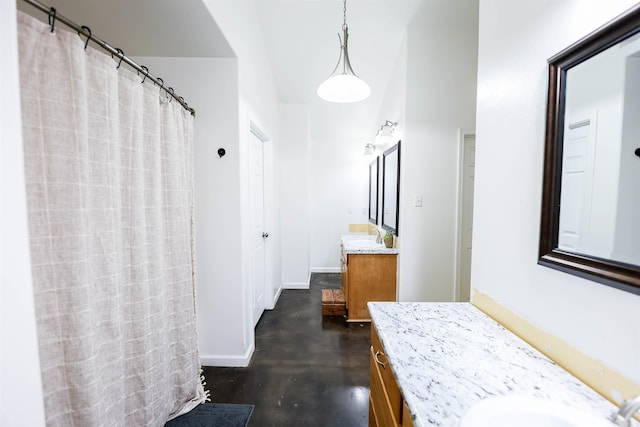 bathroom with concrete flooring and vanity