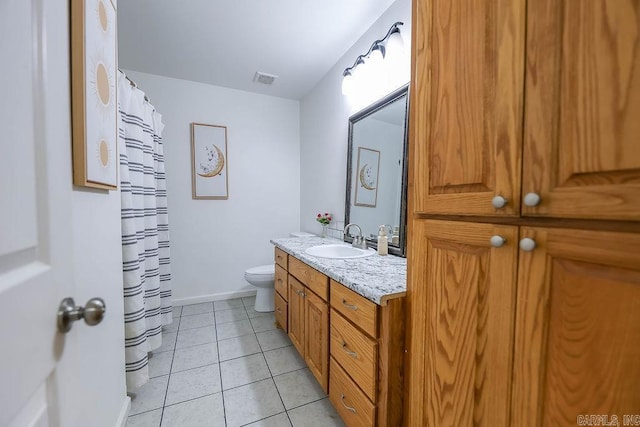 169 Whispering Oak Cir, El Dorado, AR 71730 - full bathroom with toilet, vanity, tile patterned floors, baseboards, and curtained shower