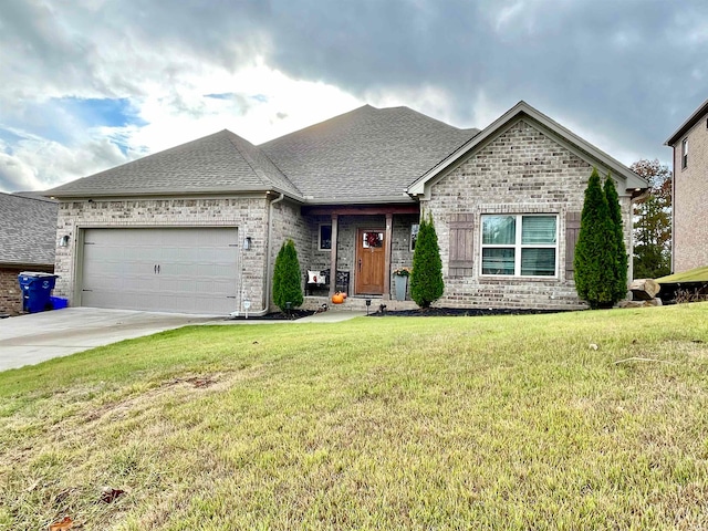 view of front of house featuring a garage and a front lawn