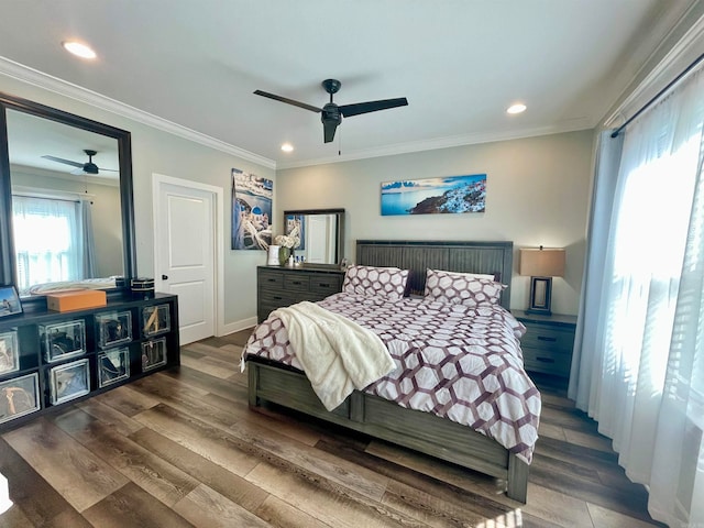 bedroom featuring hardwood / wood-style flooring, ceiling fan, and crown molding