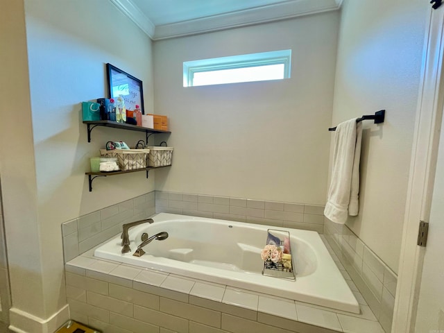 bathroom featuring ornamental molding and tiled tub