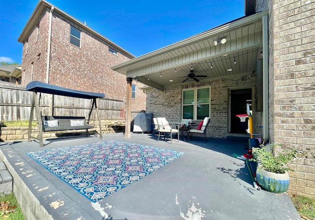 view of patio featuring ceiling fan