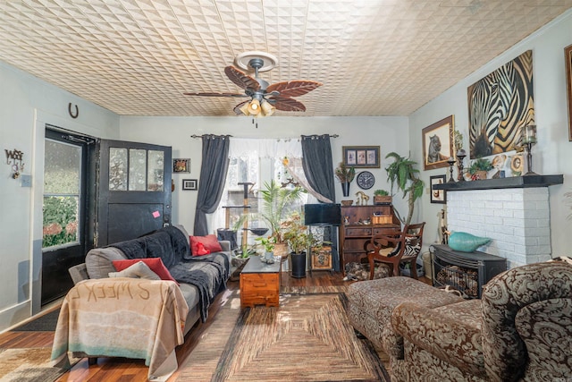 living room with hardwood / wood-style floors and ceiling fan