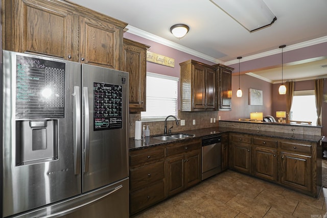 kitchen with kitchen peninsula, a wealth of natural light, crown molding, and appliances with stainless steel finishes