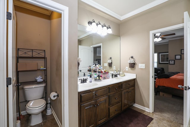 bathroom featuring toilet, vanity, ceiling fan, and crown molding