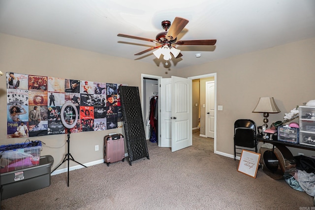 office with carpet flooring and ceiling fan