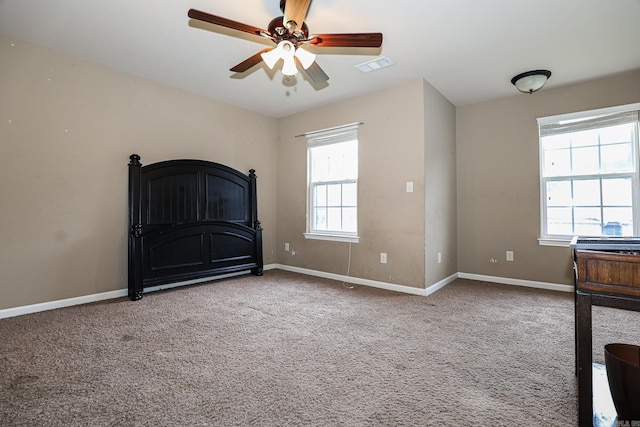 unfurnished bedroom with carpet and ceiling fan