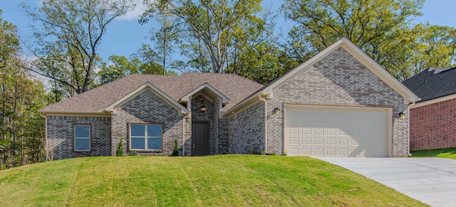 view of front of house featuring a garage and a front lawn