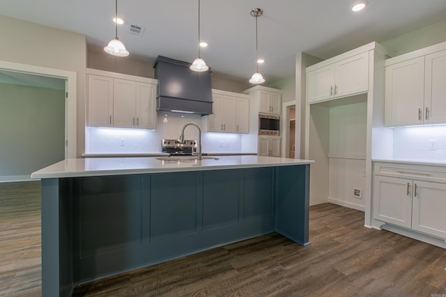 kitchen with white cabinets, decorative light fixtures, dark hardwood / wood-style flooring, and tasteful backsplash