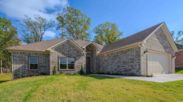 view of front of property featuring a garage and a front yard