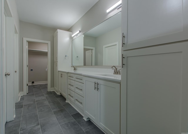 bathroom with vanity and tile patterned floors