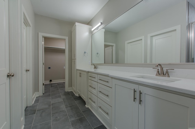 bathroom with vanity and tile patterned flooring