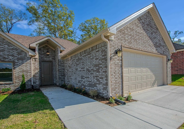 ranch-style house featuring a garage