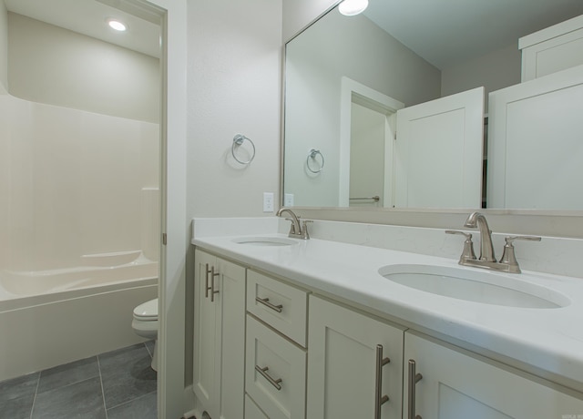 full bathroom with tile patterned flooring, vanity, toilet, and shower / bathtub combination