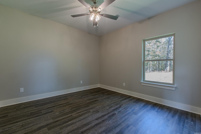 spare room with ceiling fan and dark hardwood / wood-style floors