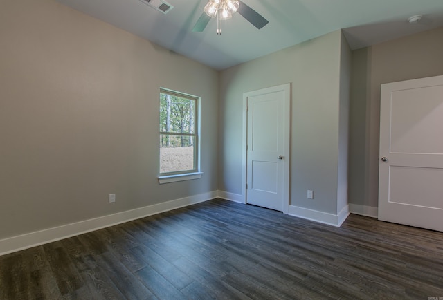 spare room featuring dark hardwood / wood-style floors and ceiling fan