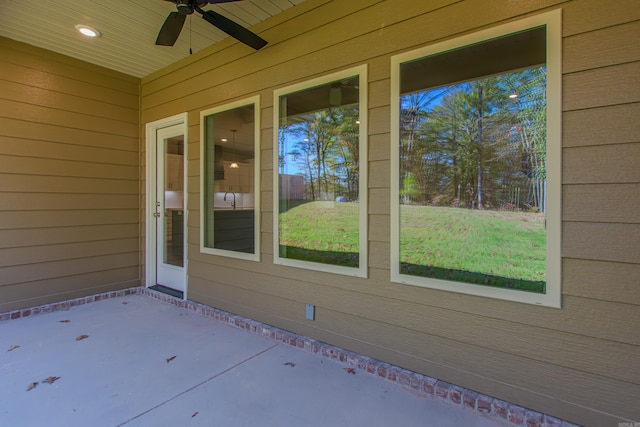 view of patio featuring ceiling fan