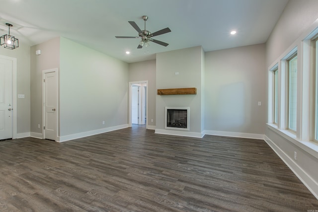 unfurnished living room with ceiling fan and dark hardwood / wood-style floors