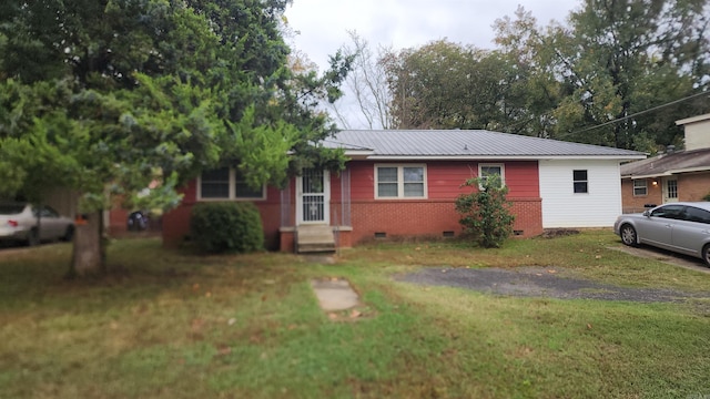 ranch-style house with a front lawn