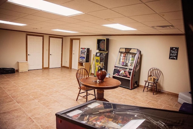 living room with a drop ceiling