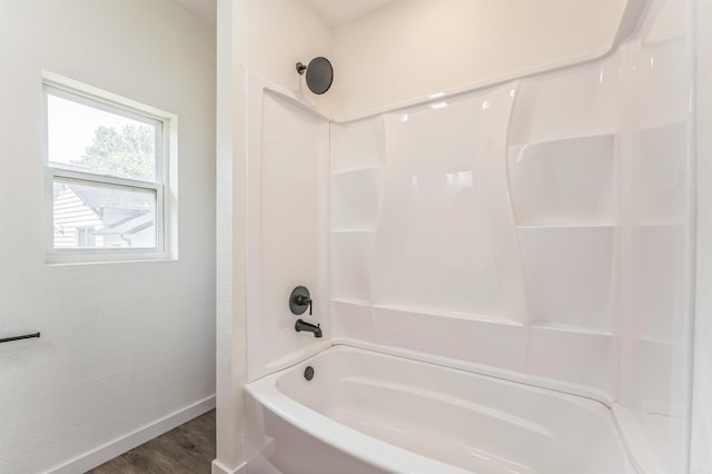 bathroom with shower / tub combination and wood-type flooring