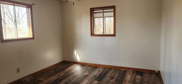 unfurnished room featuring dark hardwood / wood-style floors